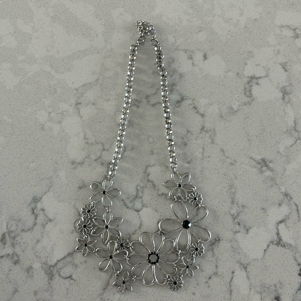 Costume jewelry necklace flower design with black inset